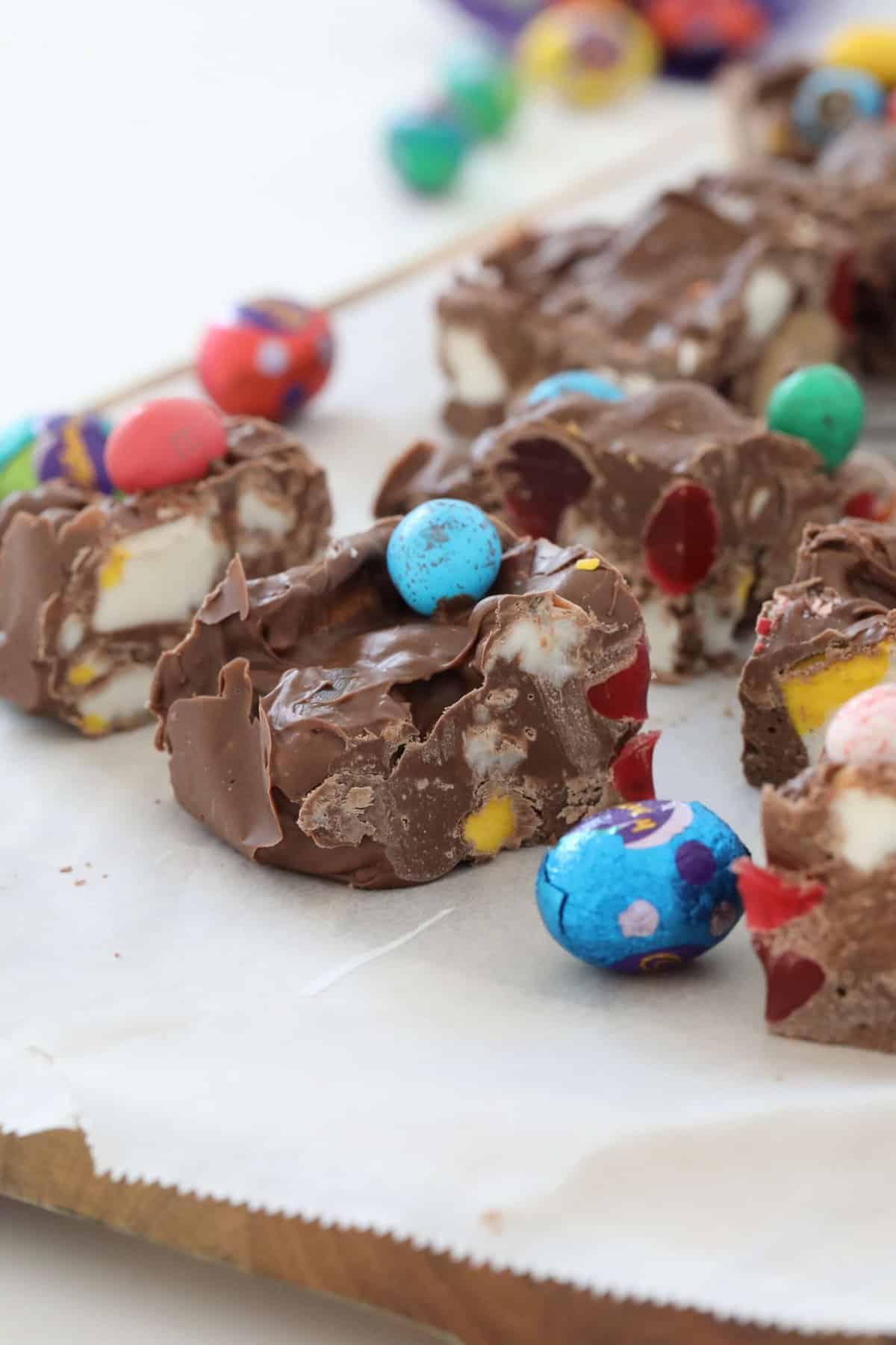 Chocolate squares with marshmallows, lollies and easter eggs.