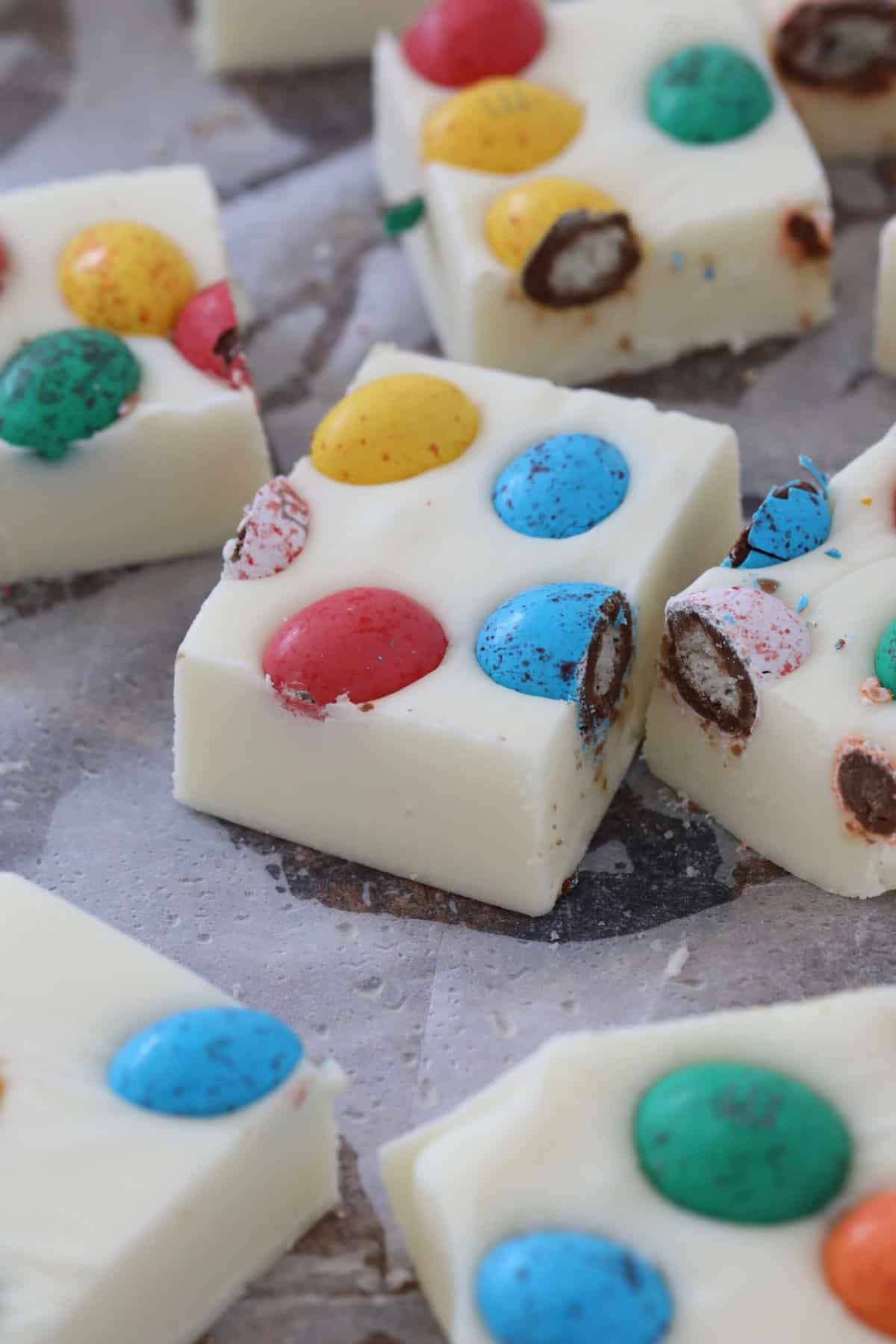Pieces of white chocolate fudge with Easter eggs.