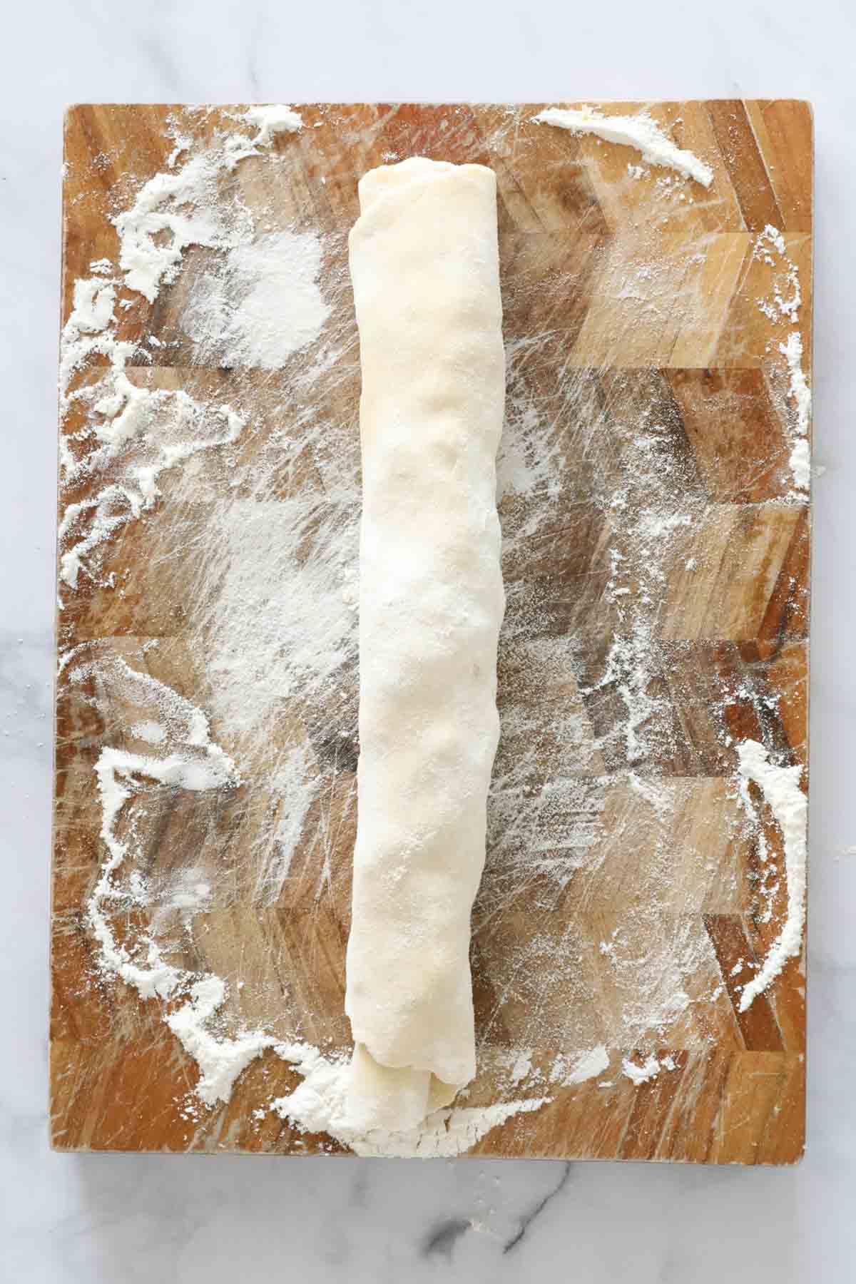 A dough rolled up into a tube.