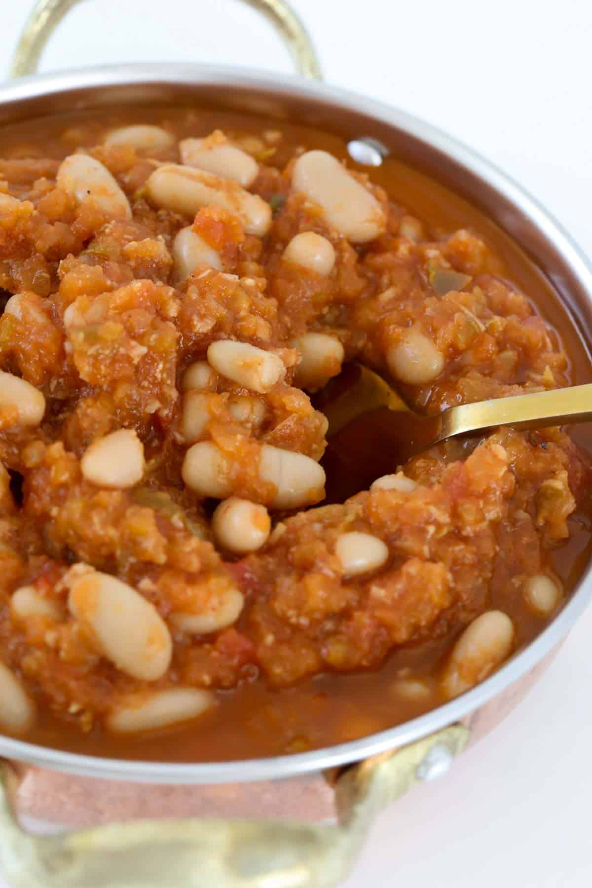 A bowl filled with homemade baked beans.