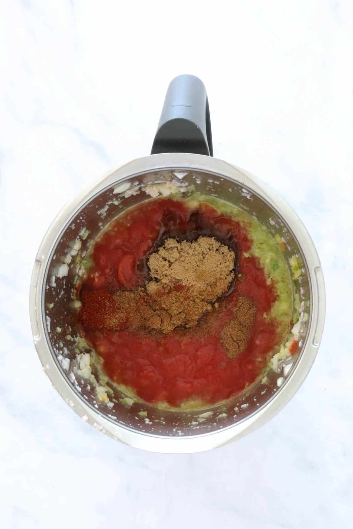 Spices and tomatoes in a Thermomix.