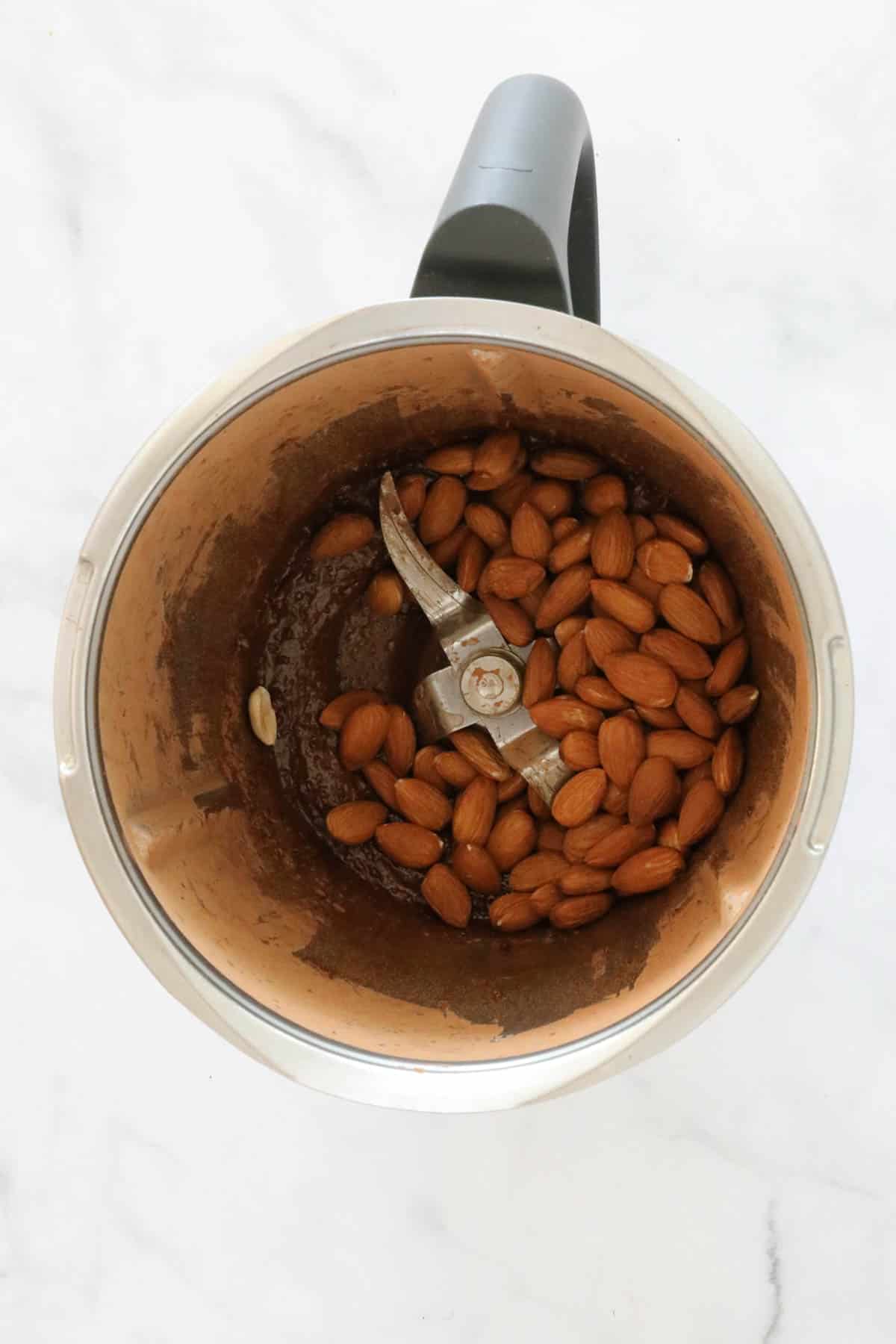 Almonds in a stainless jug.