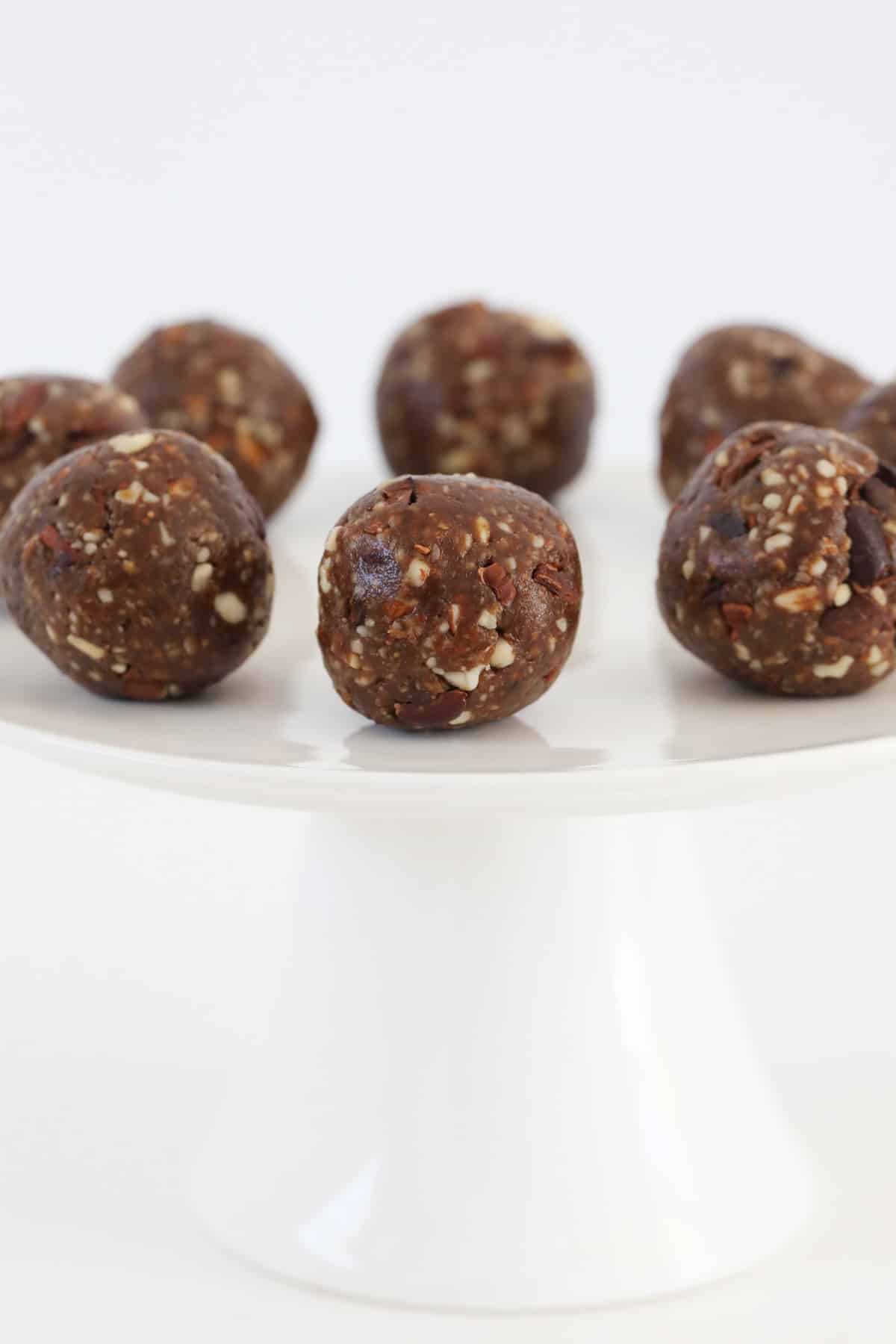 A plate of chocolate brownie bliss balls.