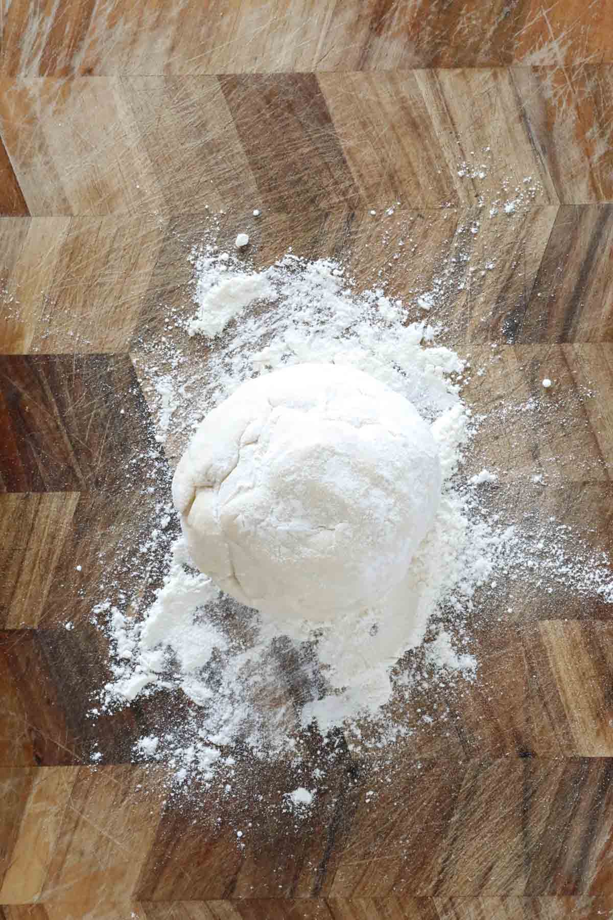 Dough on a chopping board.