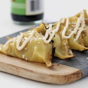 Homemade gyozas on a plate.