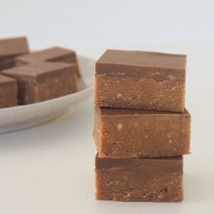Three pieces of Caramello slice stacked on top of each other.