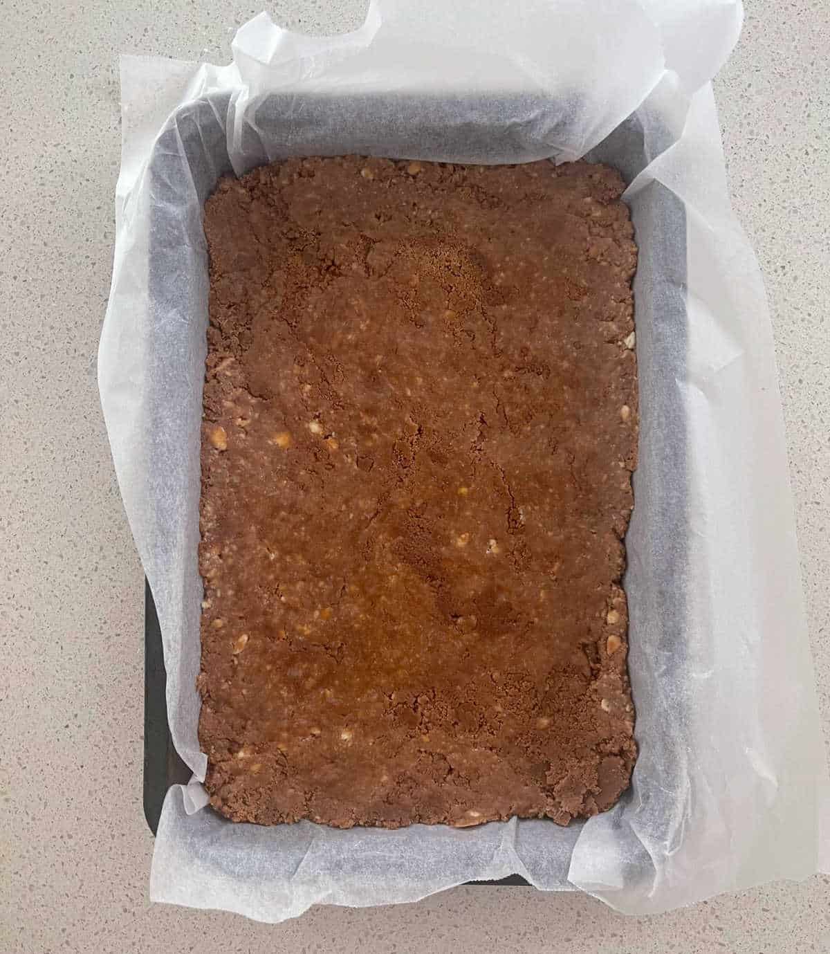 Caramello Slice in a slice tray without chocolate layer.
