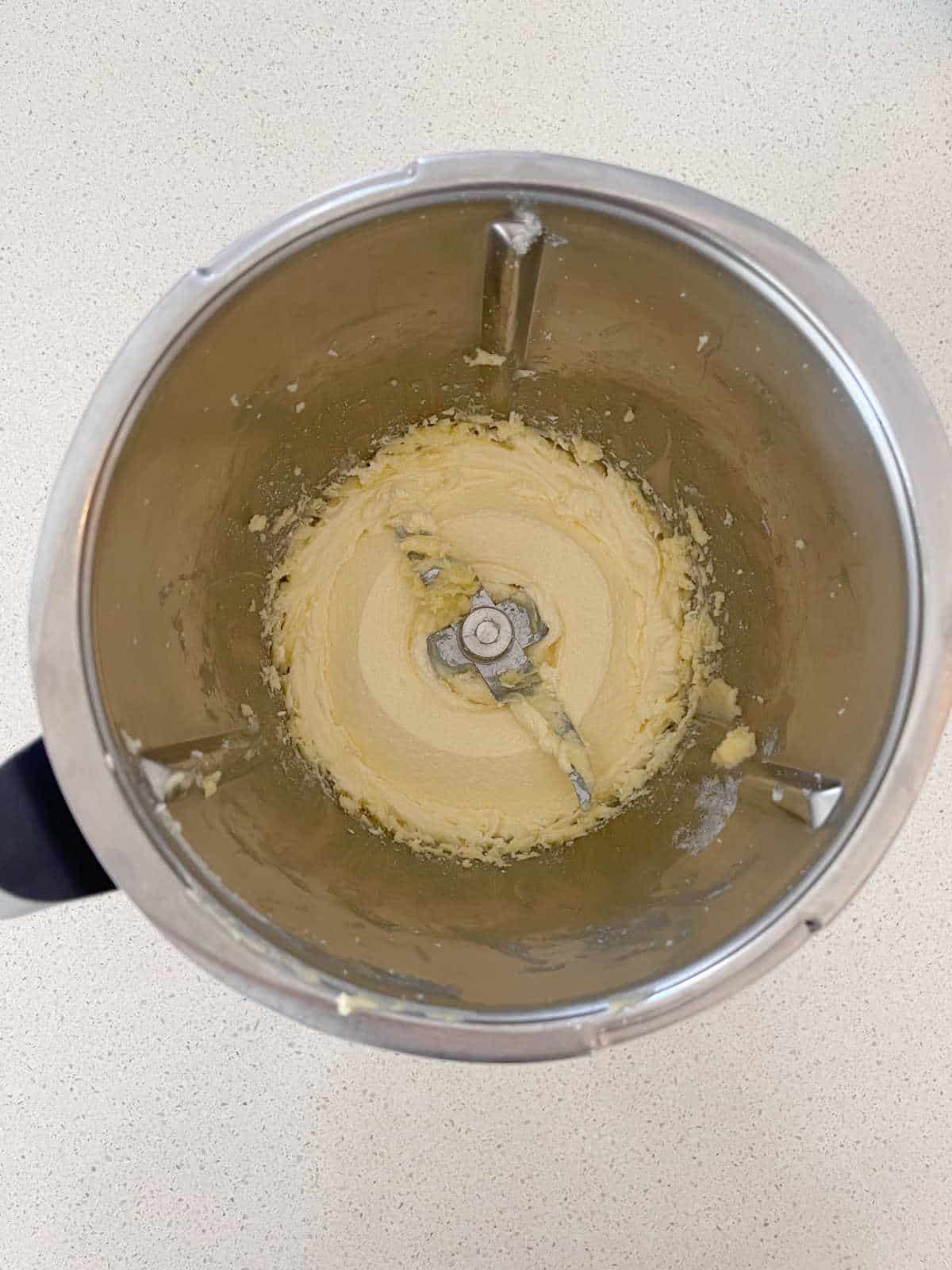 butter and sugar combined in a Thermomix bowl.