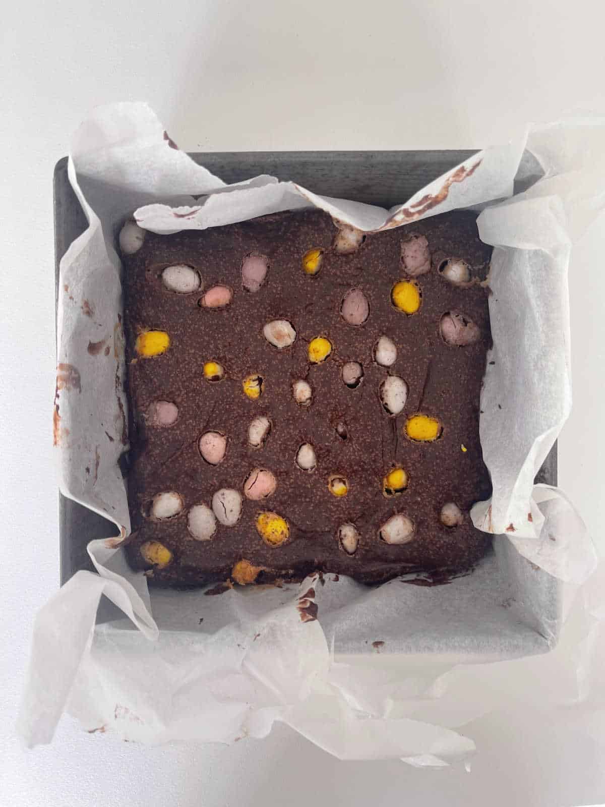 Baked Easter egg Brownie in baking tin.