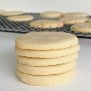 Stack of Sugar Cookies on a white bench top.