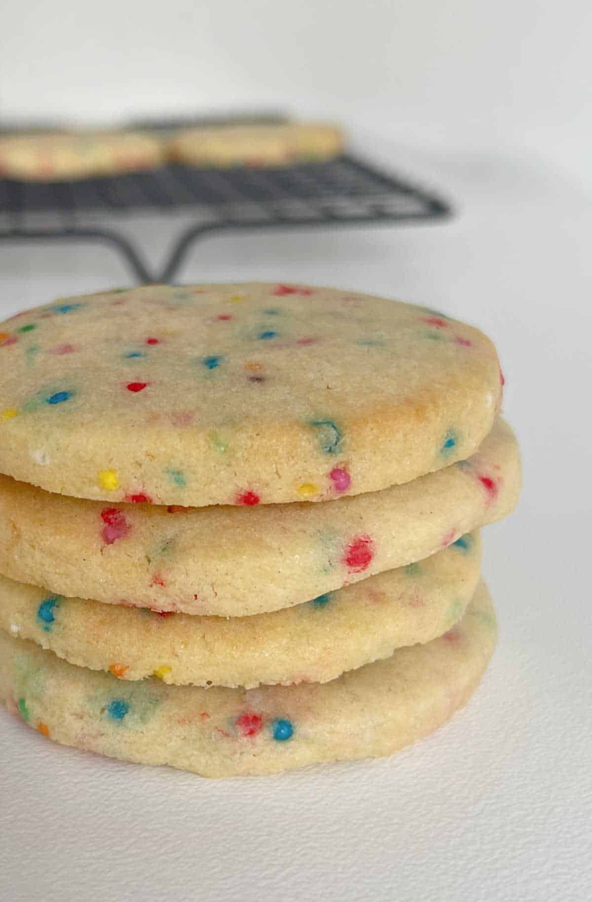 Sugar cookies with 100s and 1000s added stacked on top of each other.