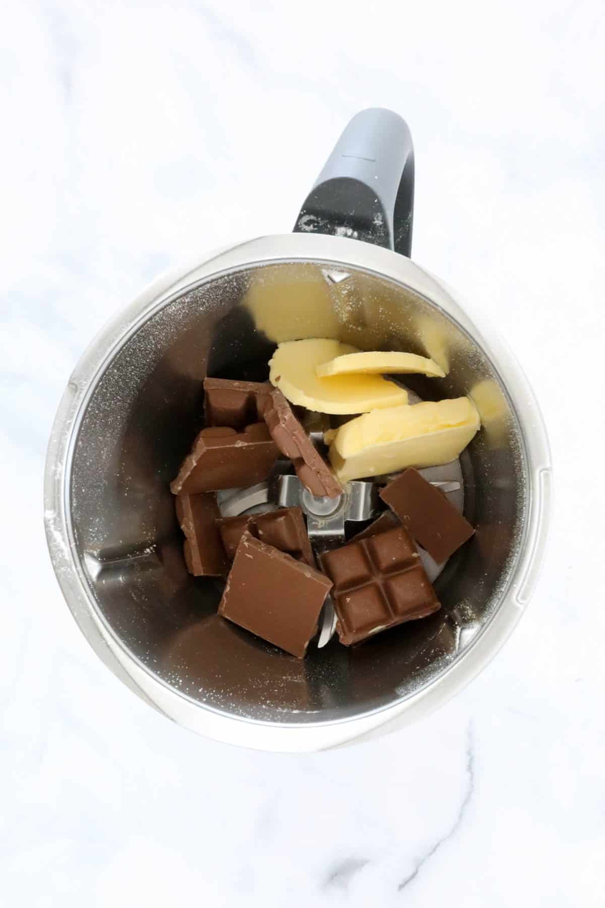 Butter and chocolate in a Thermomix bowl.