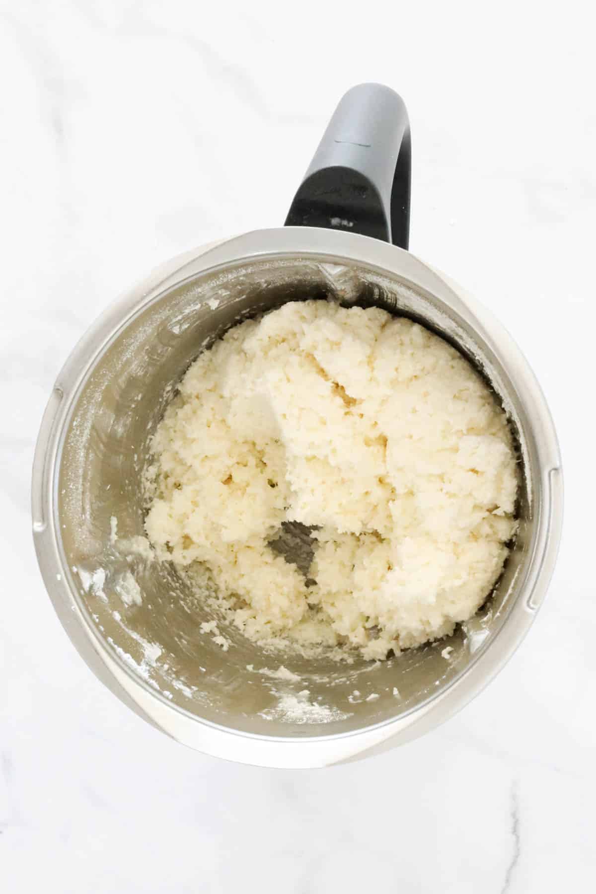 White coconut mixture in a Thermomix.