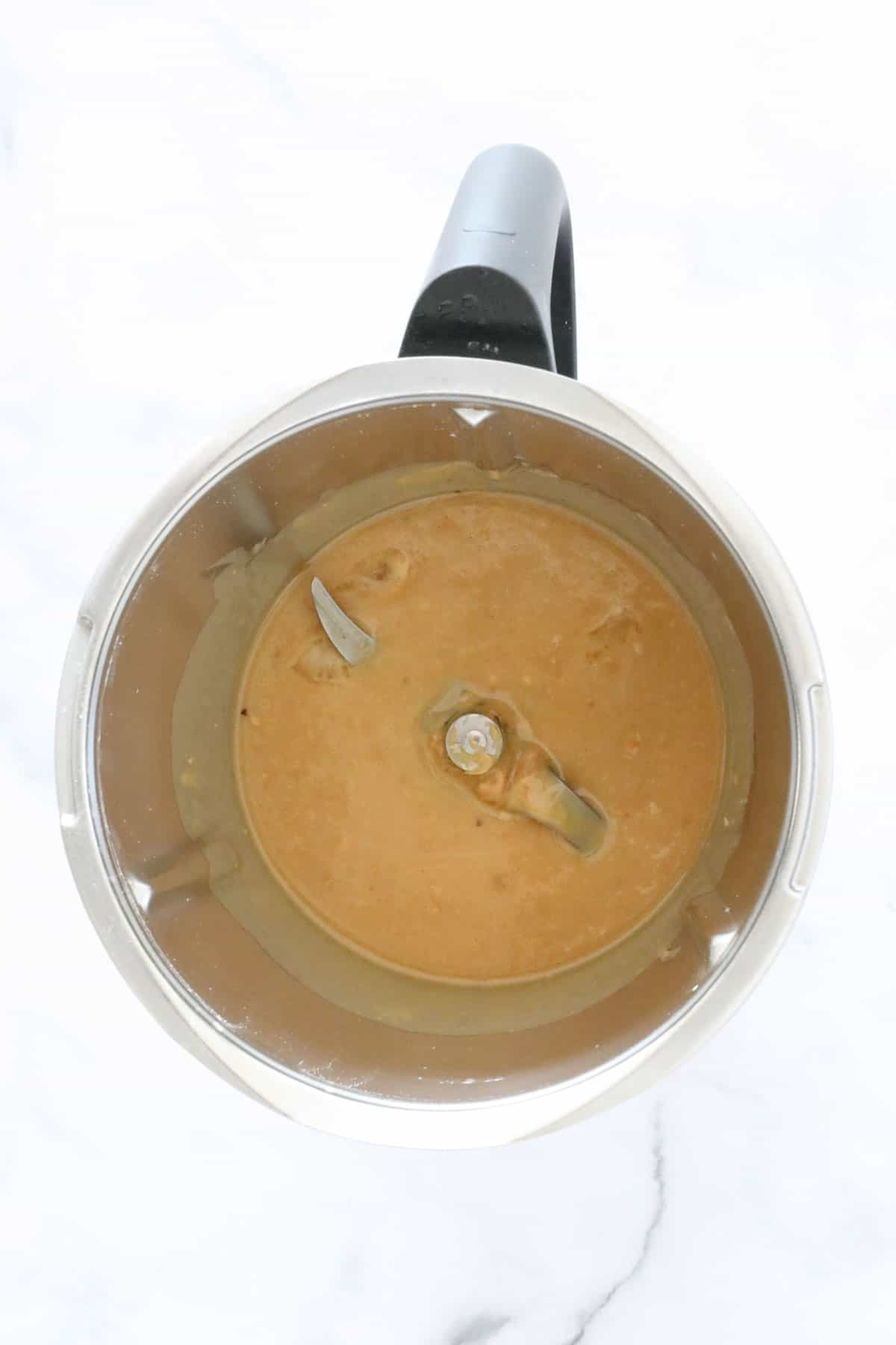 Melted peanut butter and honey in a Thermomix.
