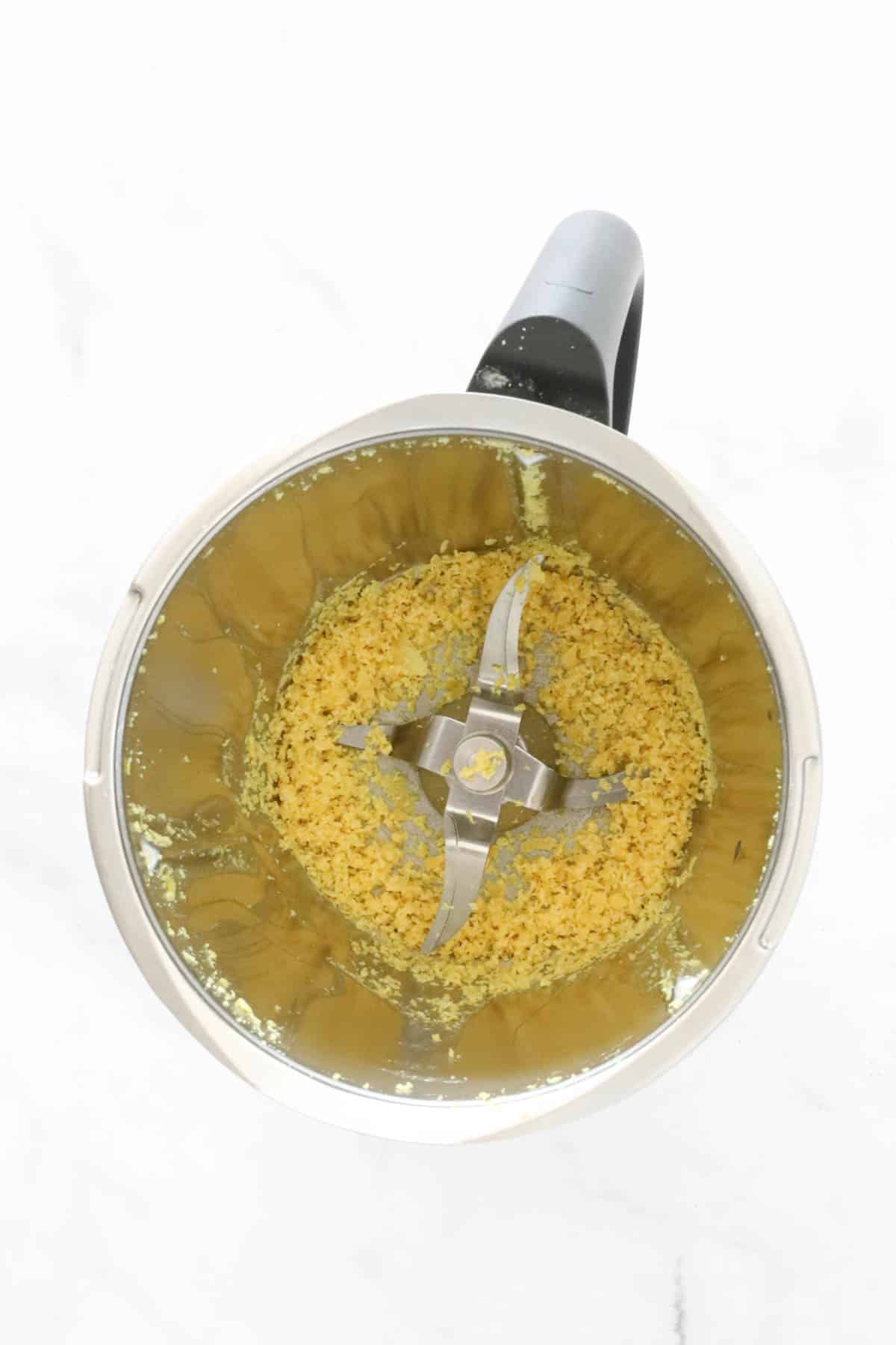 Grated lemon zest in a Thermomix.