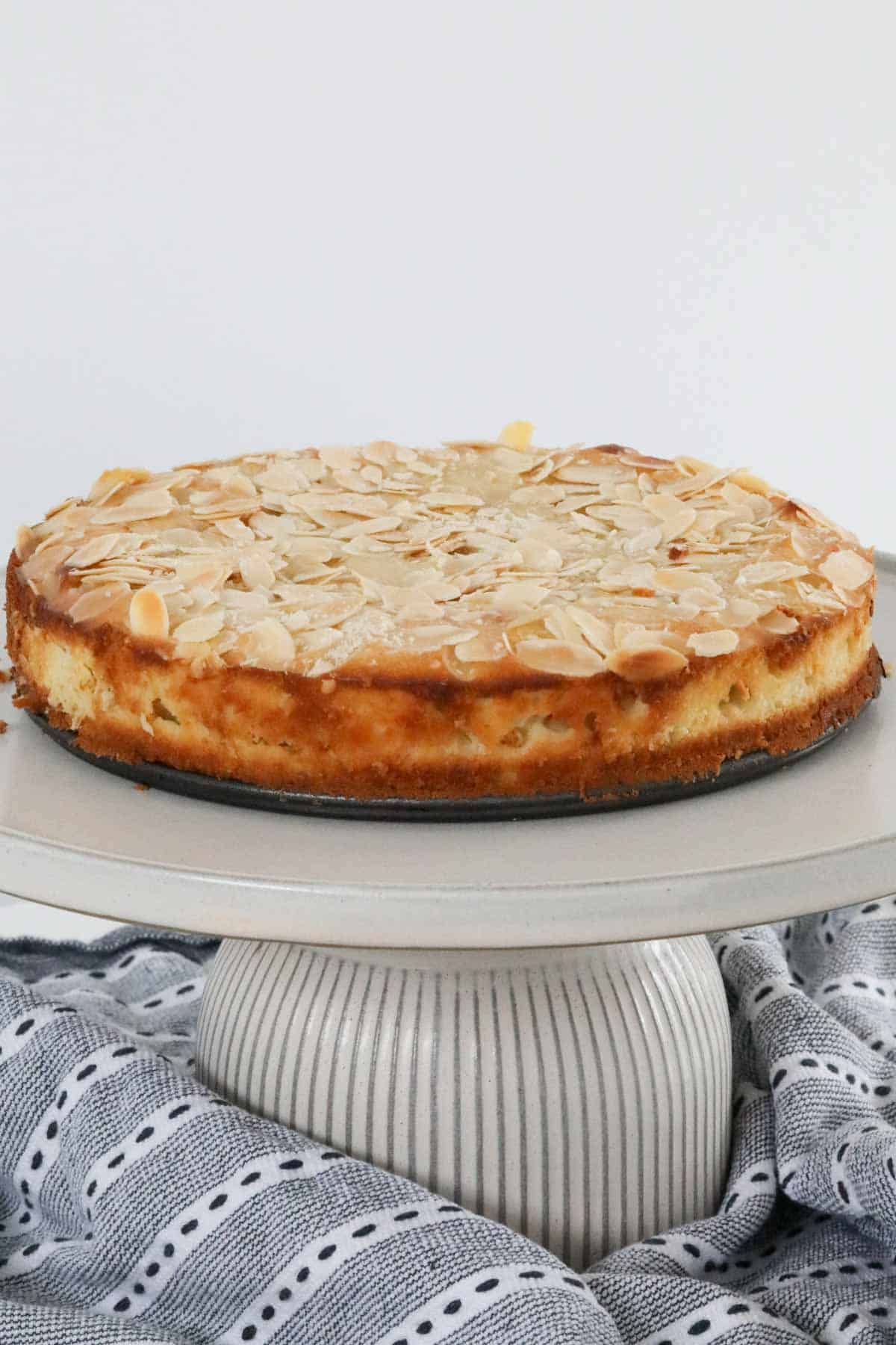 A cake topped with flaked almonds.