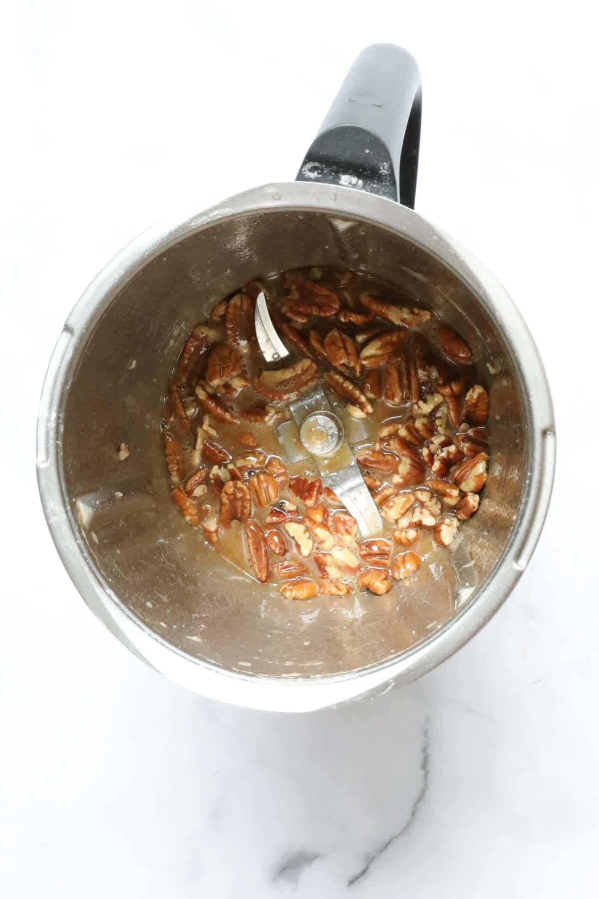 Pecans in a Thermomix bowl.
