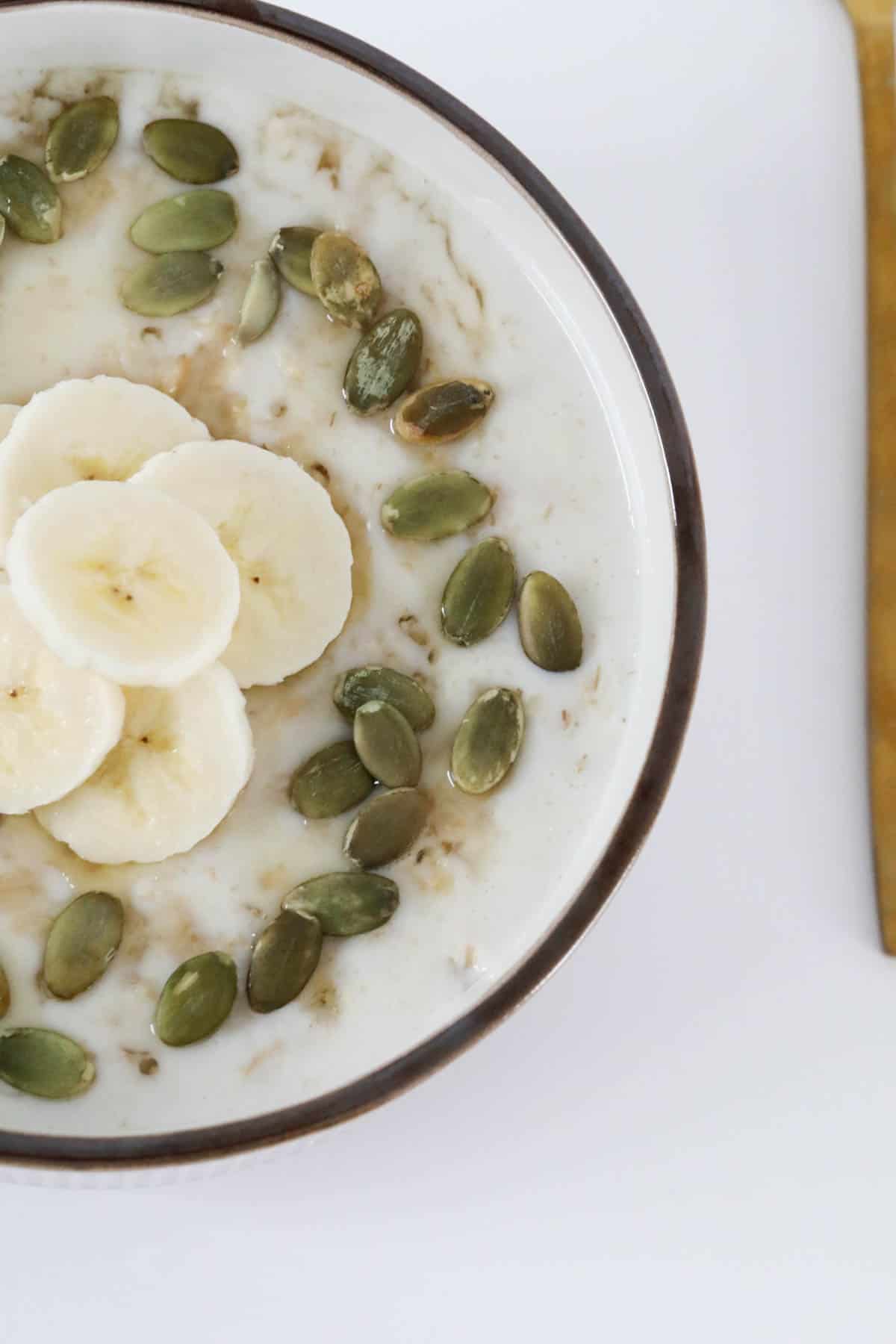 Cooked oats with seeds and banana.