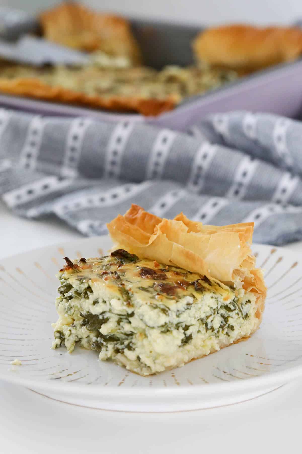 A piece of spinach and feta filo pie.