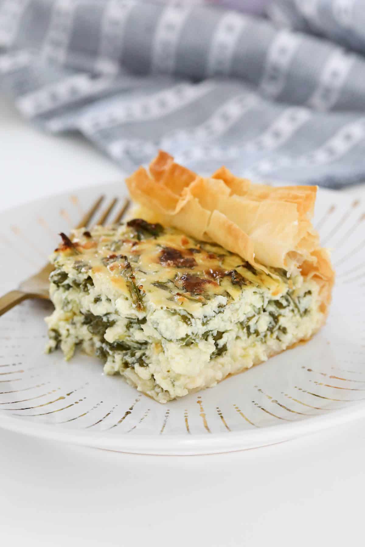 A slice of spinach and cheese pie.