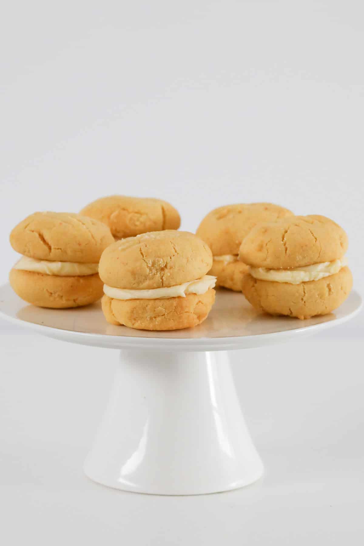 A cake stand topped with yoyo biscuits.