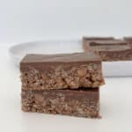 Two pieces Mars Bar Slice sitting on top of each other.