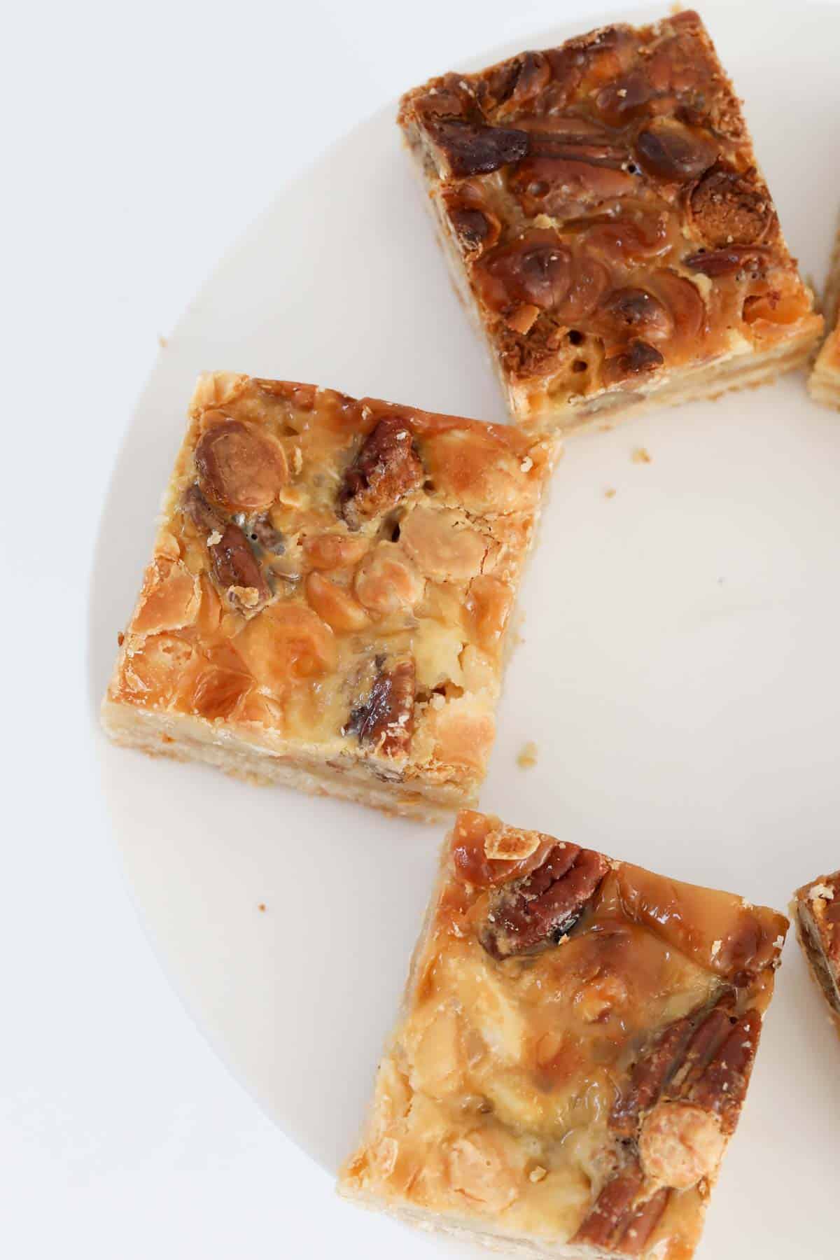 An overhead shot of caramel slice with nuts.