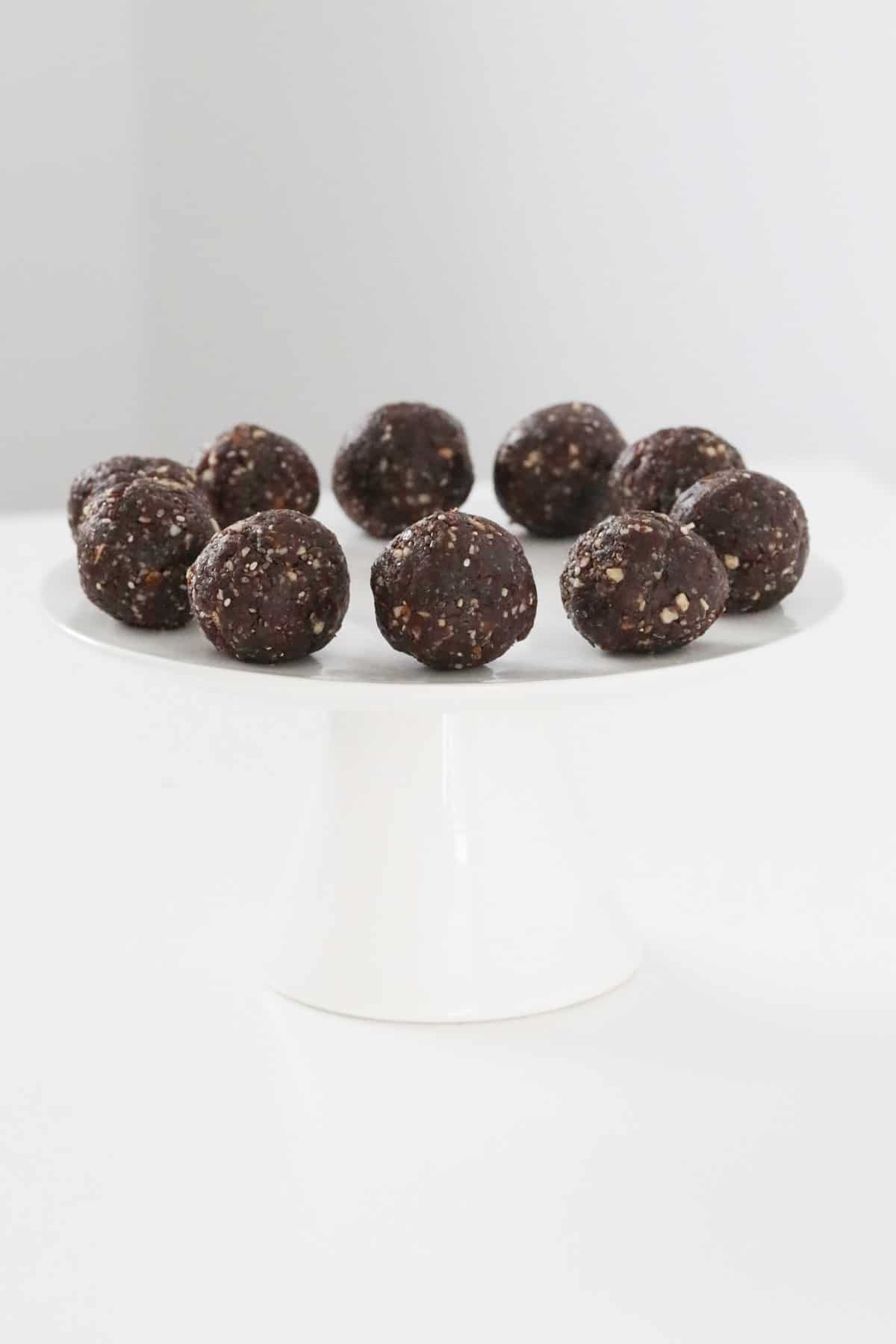 A plate of nutty chocolate protein balls.