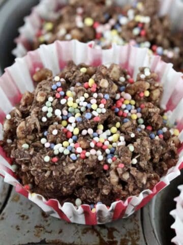 A chocolate crackle on top of a muffin tin.