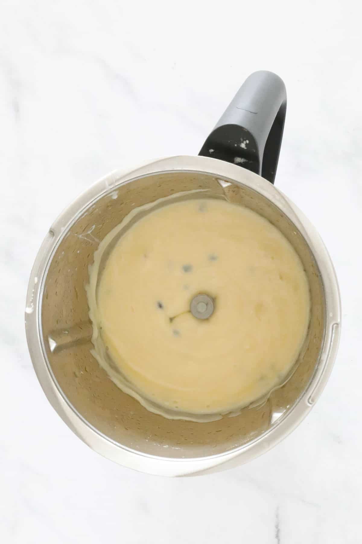 Creamy passionfruit mixture in a Thermomix.