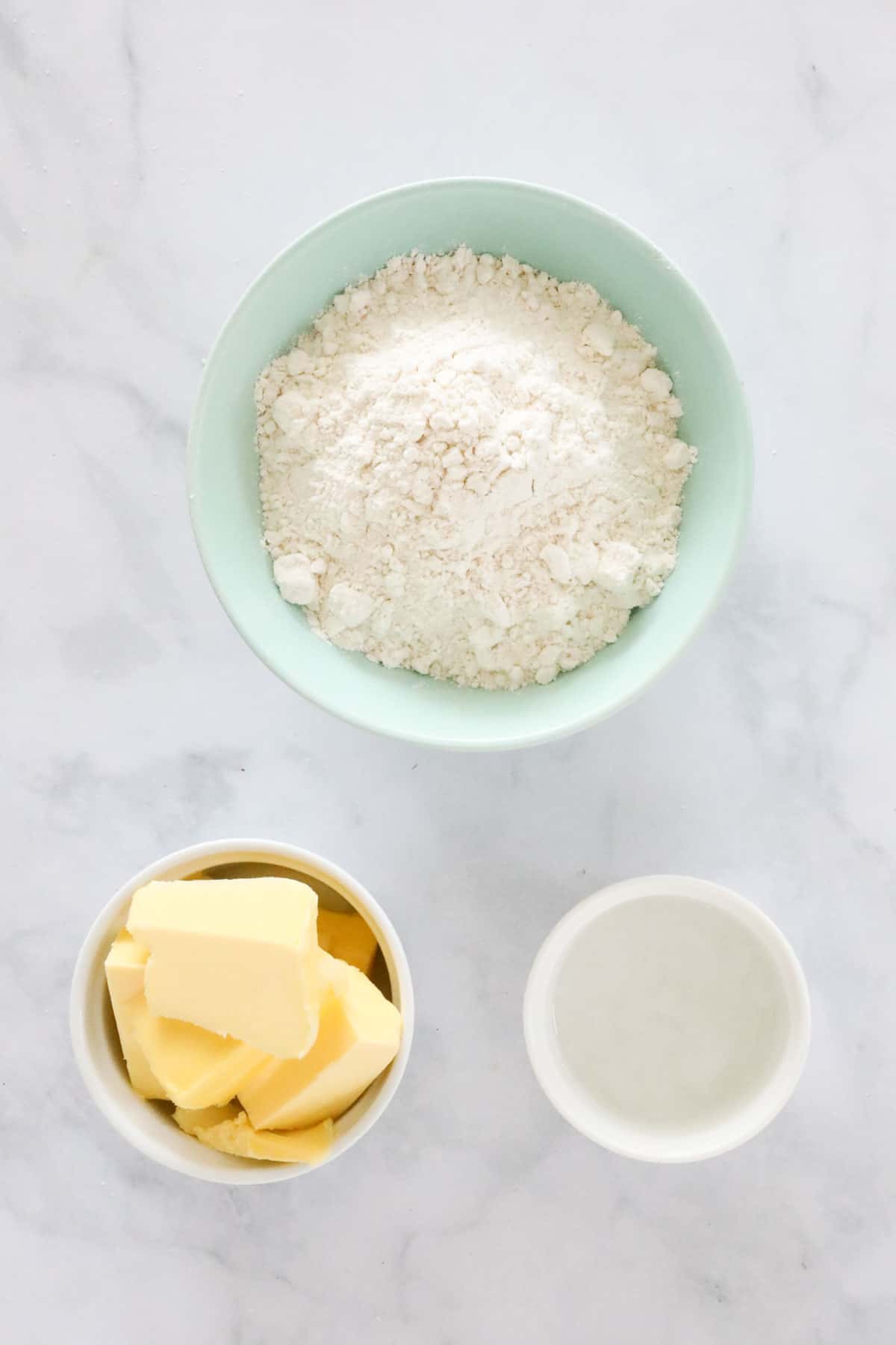 Bowls of flour, butter and water.