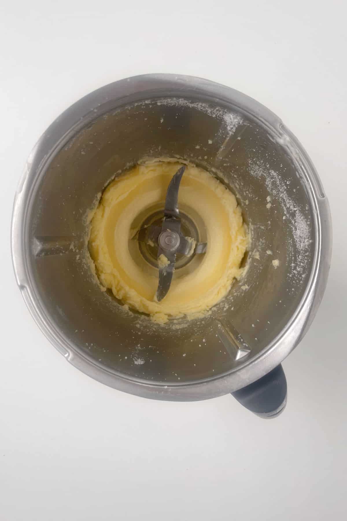 Butter and sugar combined in a thermomix bowl.