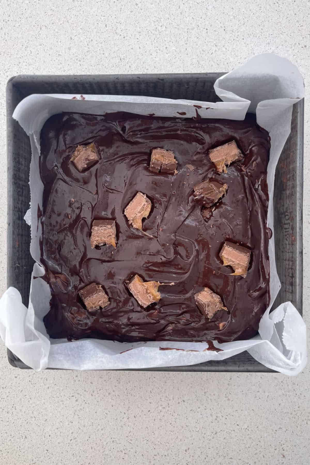 Mars Bar Brownies in a baking dish ready to go into the oven.