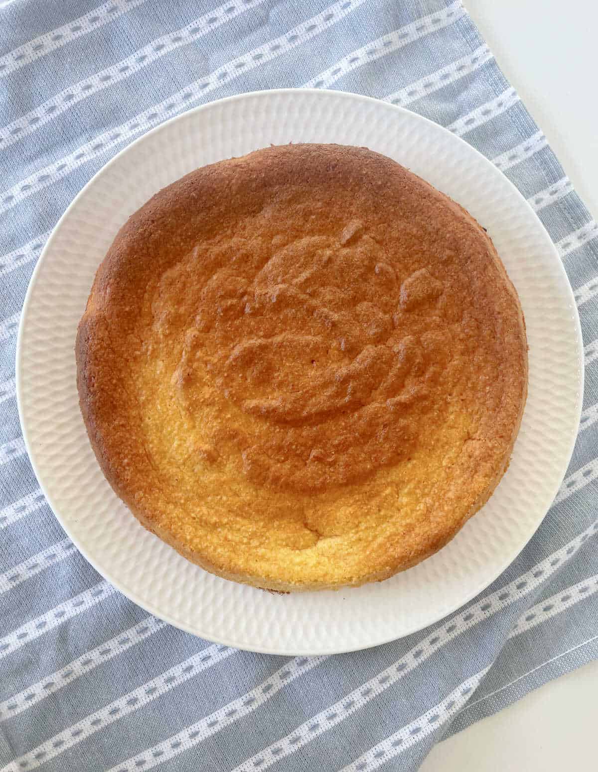 Overhead view of whole orange cake straight from the oven.