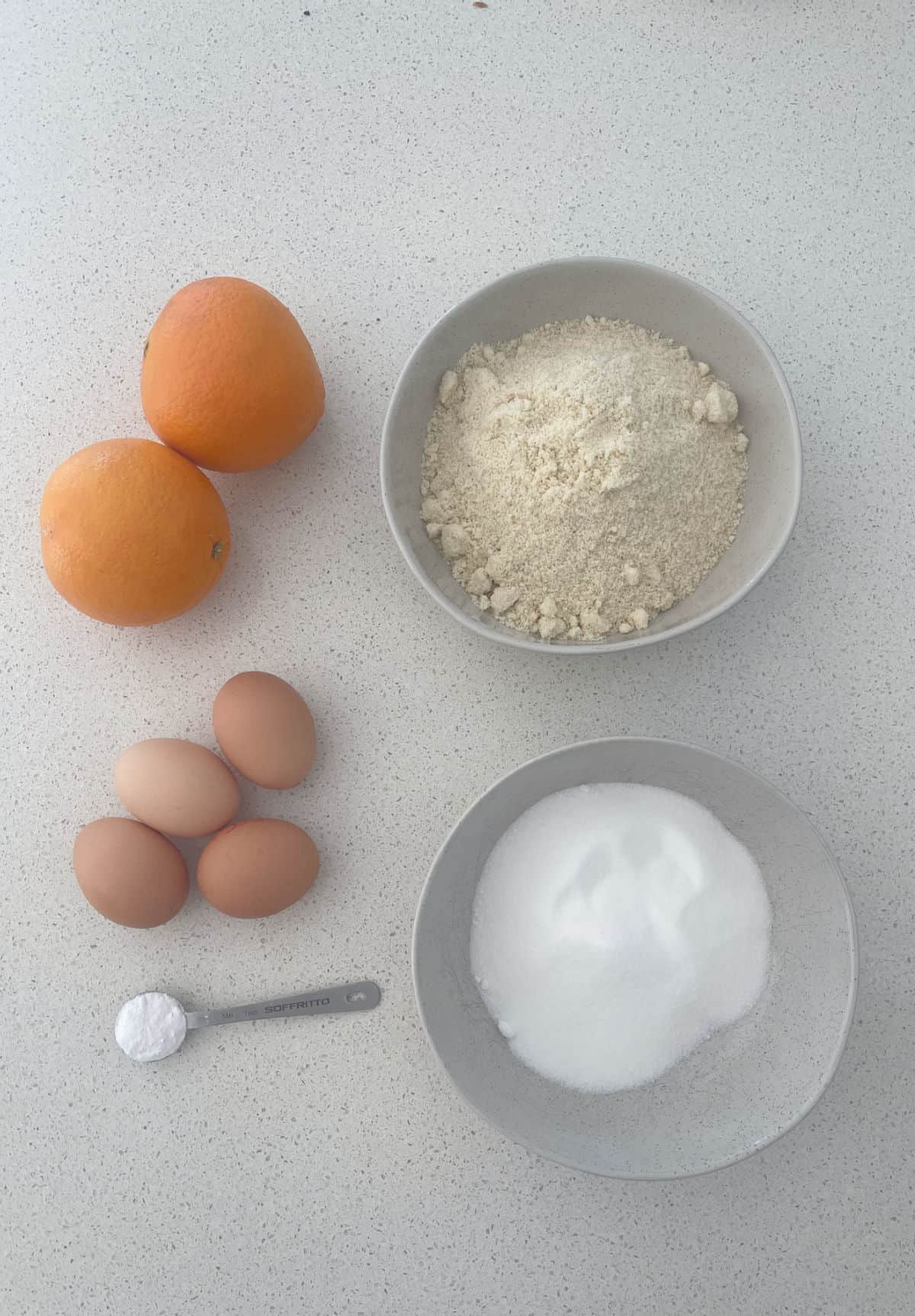 Ingredients to make a whole orange cake.