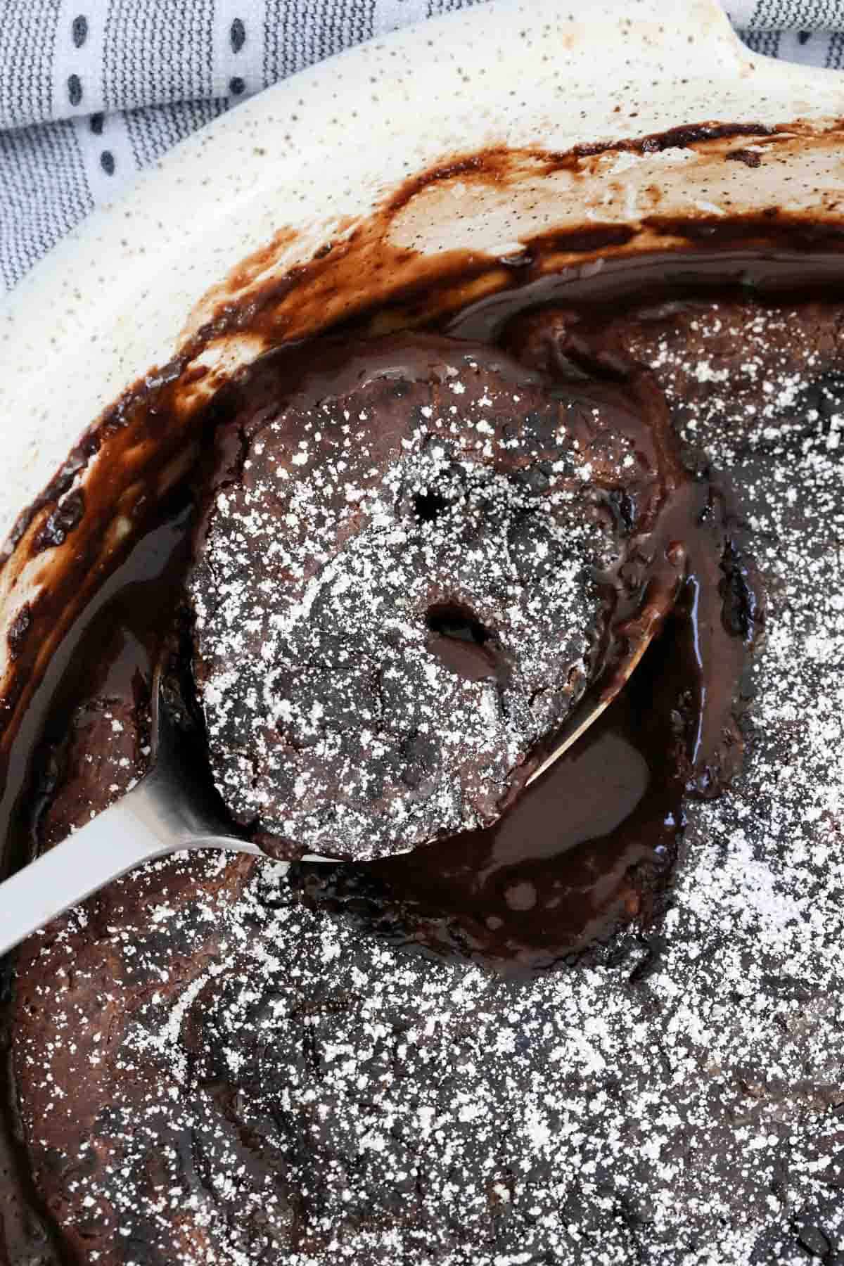A spoonful of chocolate self saucing pudding.