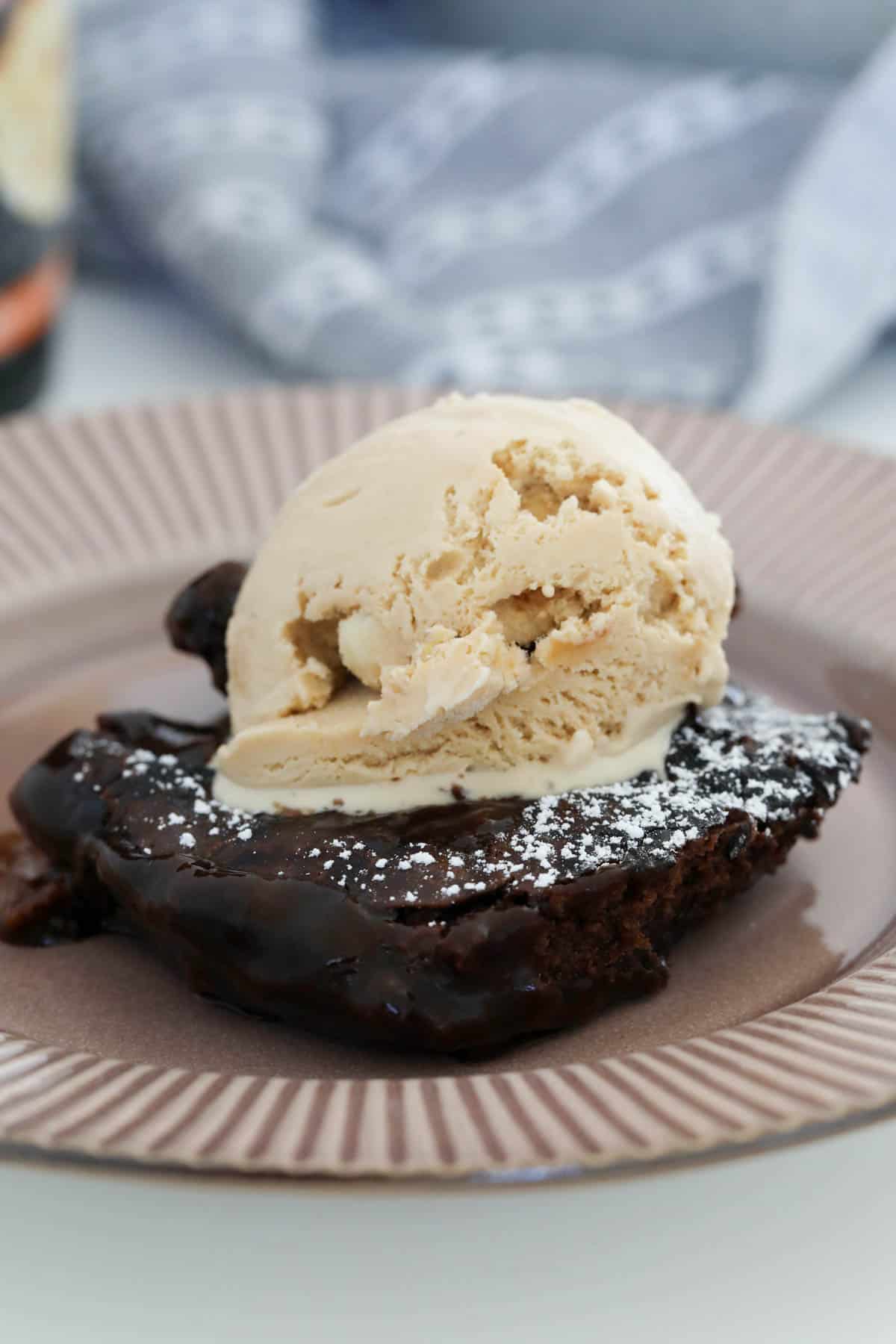 Ice cream on top of chocolate pudding.