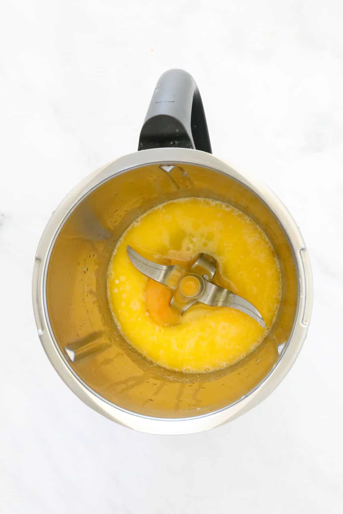 Egg and melted butter in a Thermomix.