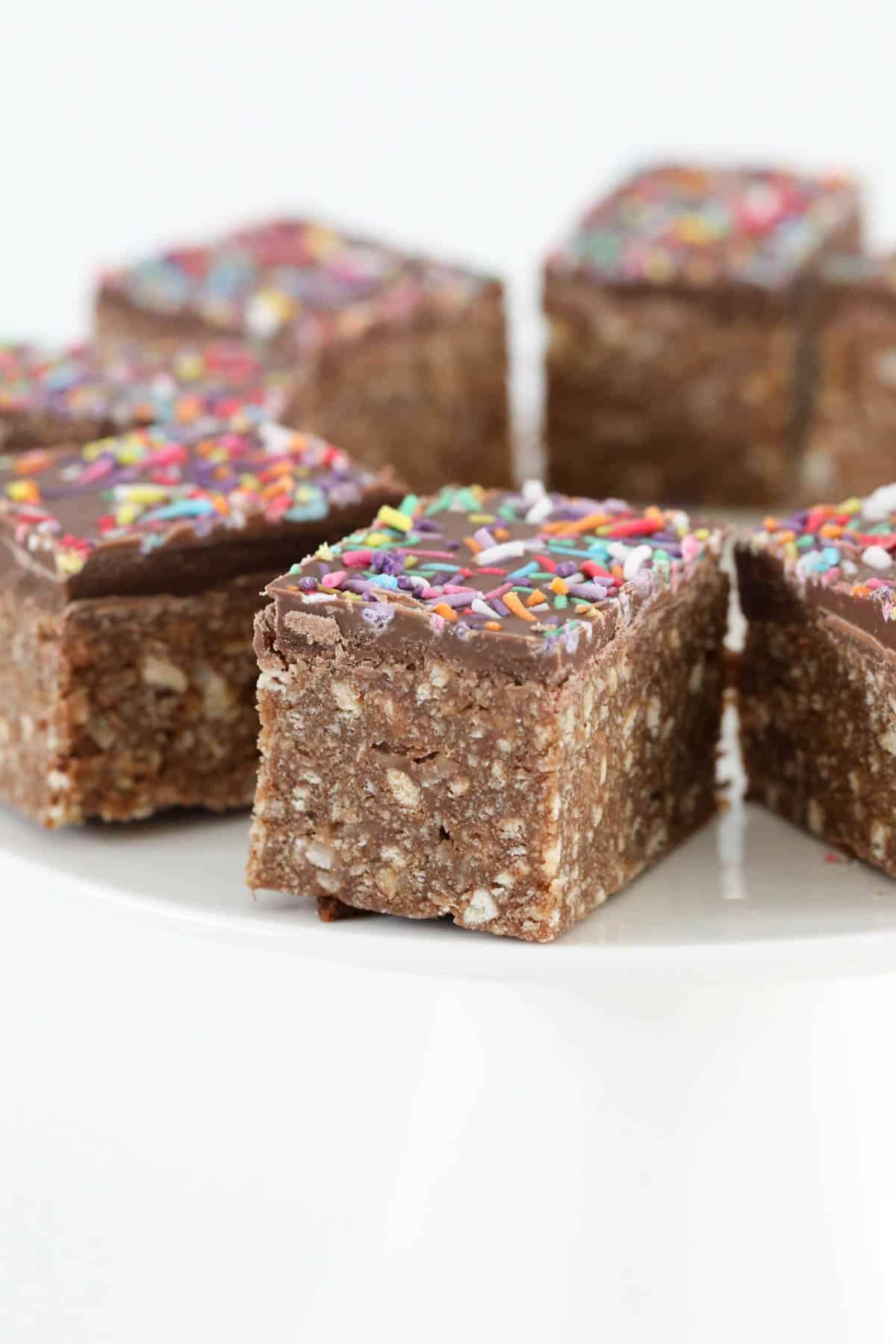 Chocolate slice with sprinkles on top.