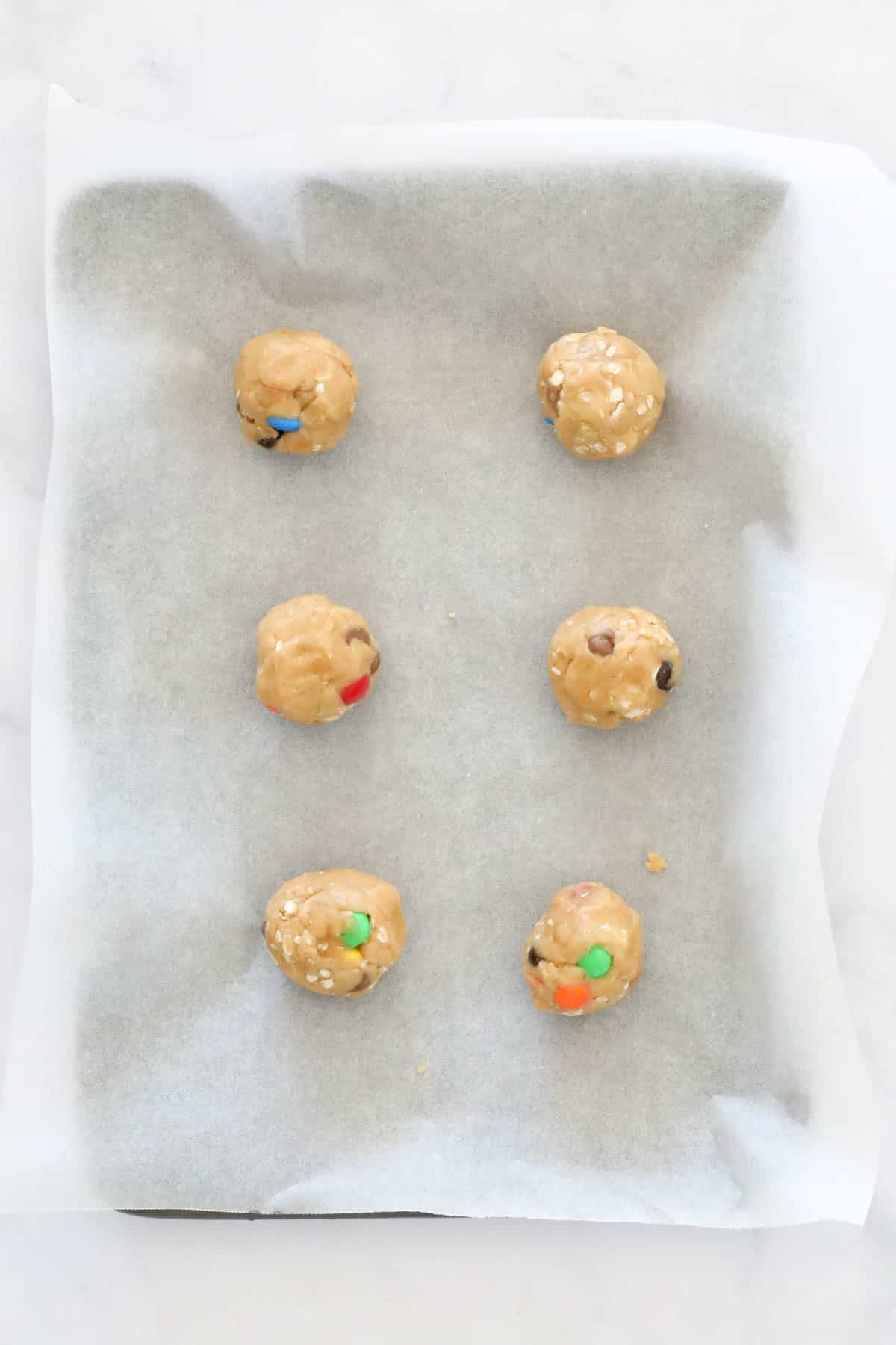 Cookie dough balls on a tray.