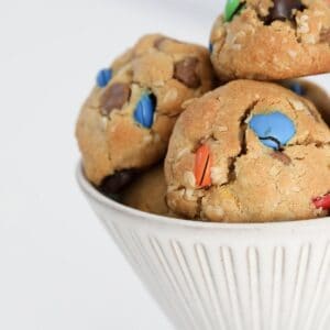 M&M cookies in a cup.