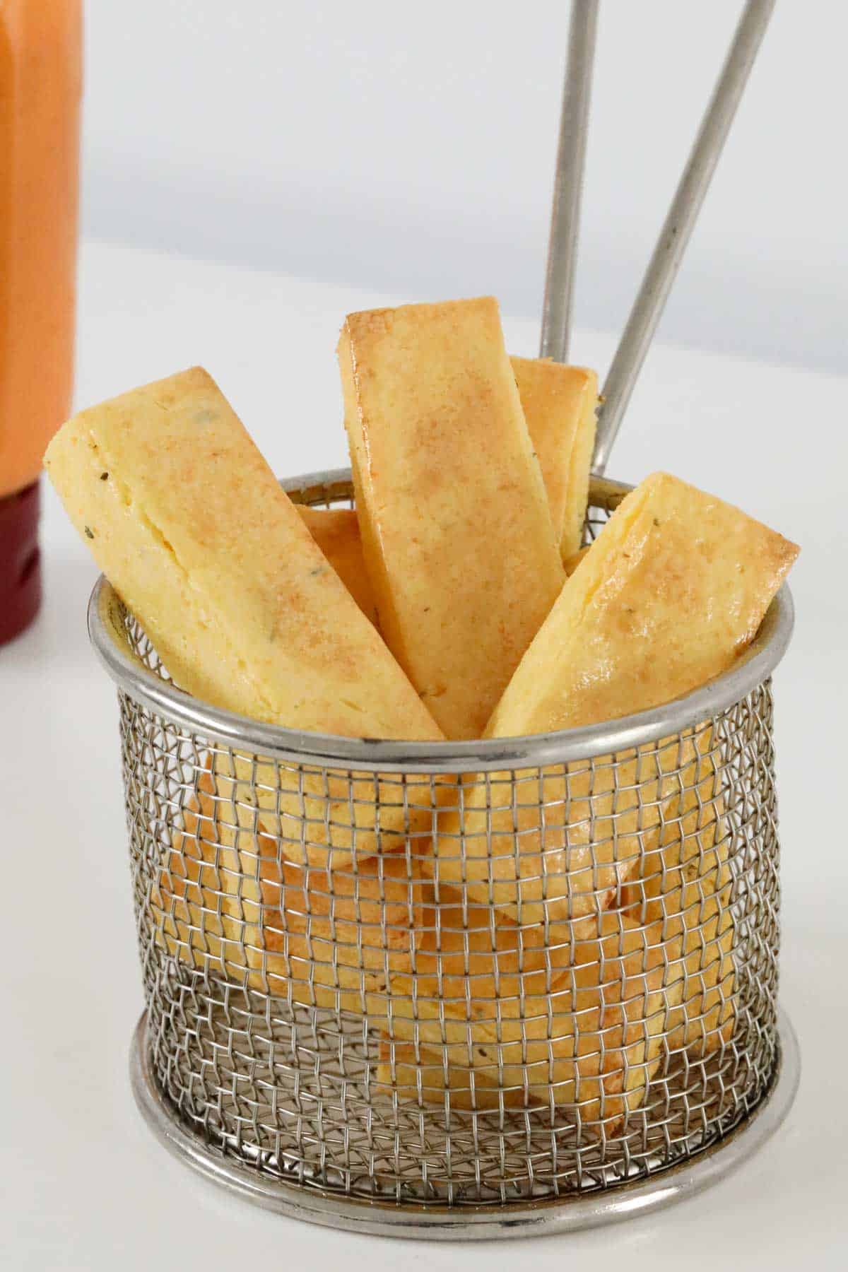 Polenta fries in a chip basket.