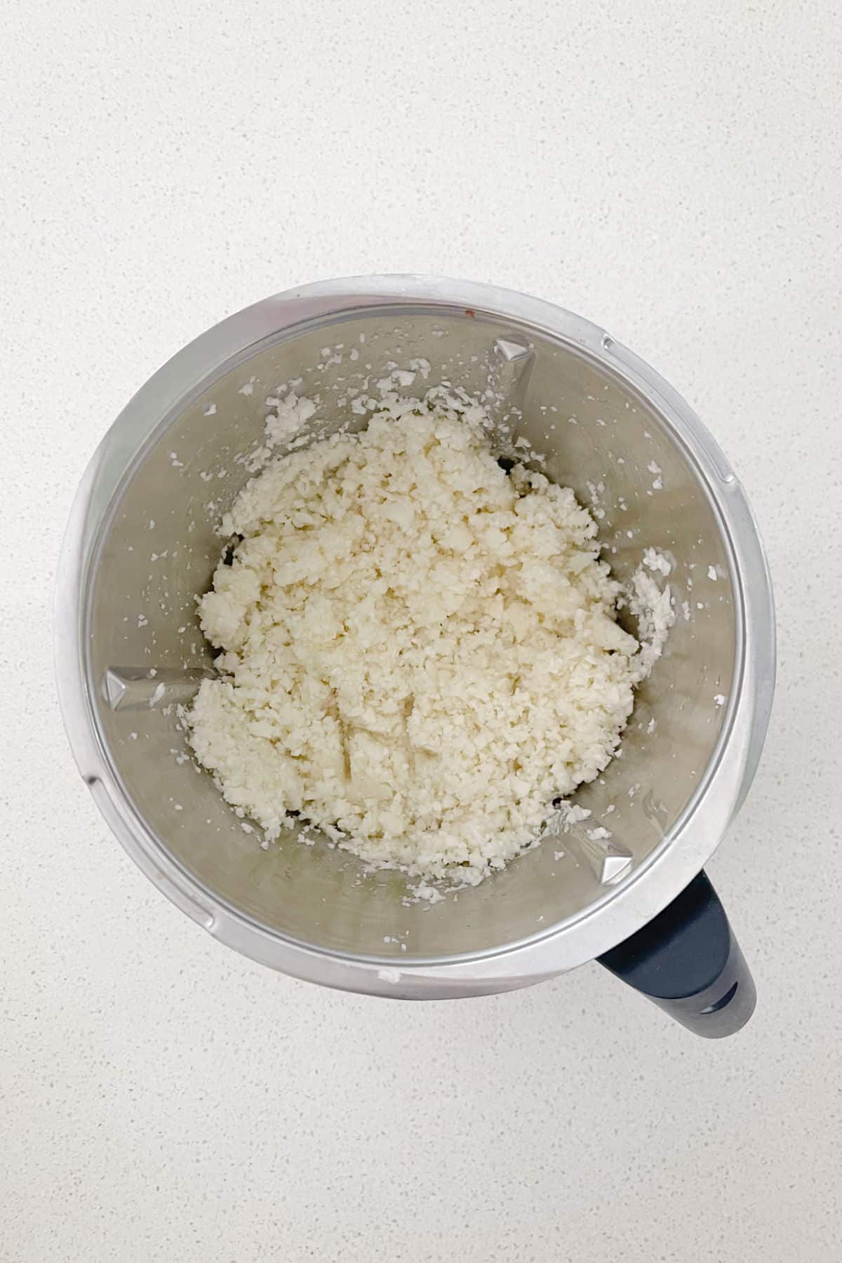 Grated Cauliflower in a Thermomix Bowl.