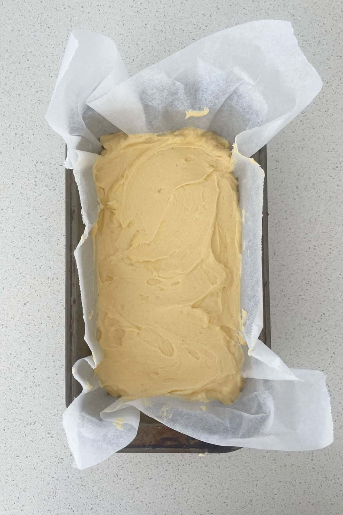 Pound Cake batter in a loaf tin.