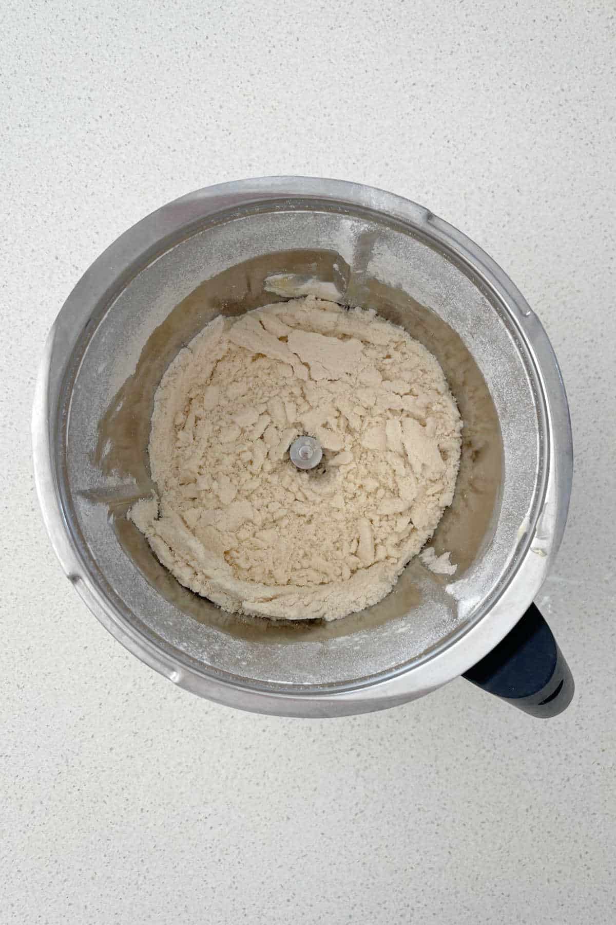 butter, self-raising flour and baking powder combined in a thermomix bowl.