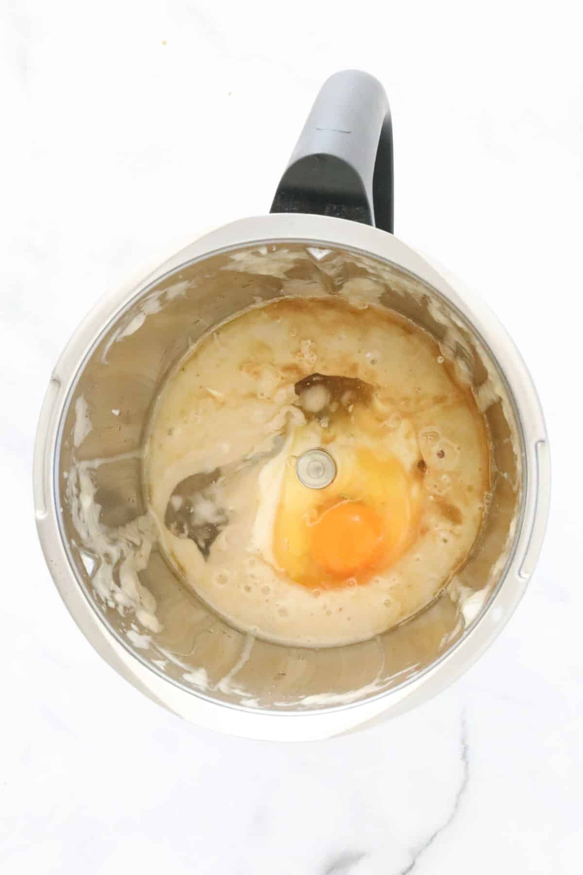 Egg on top of a creamy mixture in a Thermomix.