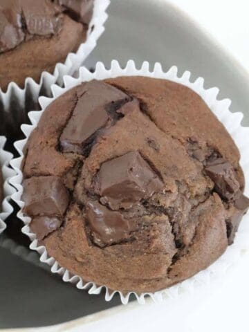 Chocolate chunk muffins in a bowl.