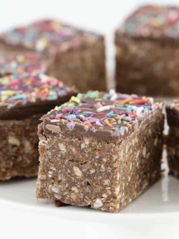 Chocolate slice with sprinkles on top.