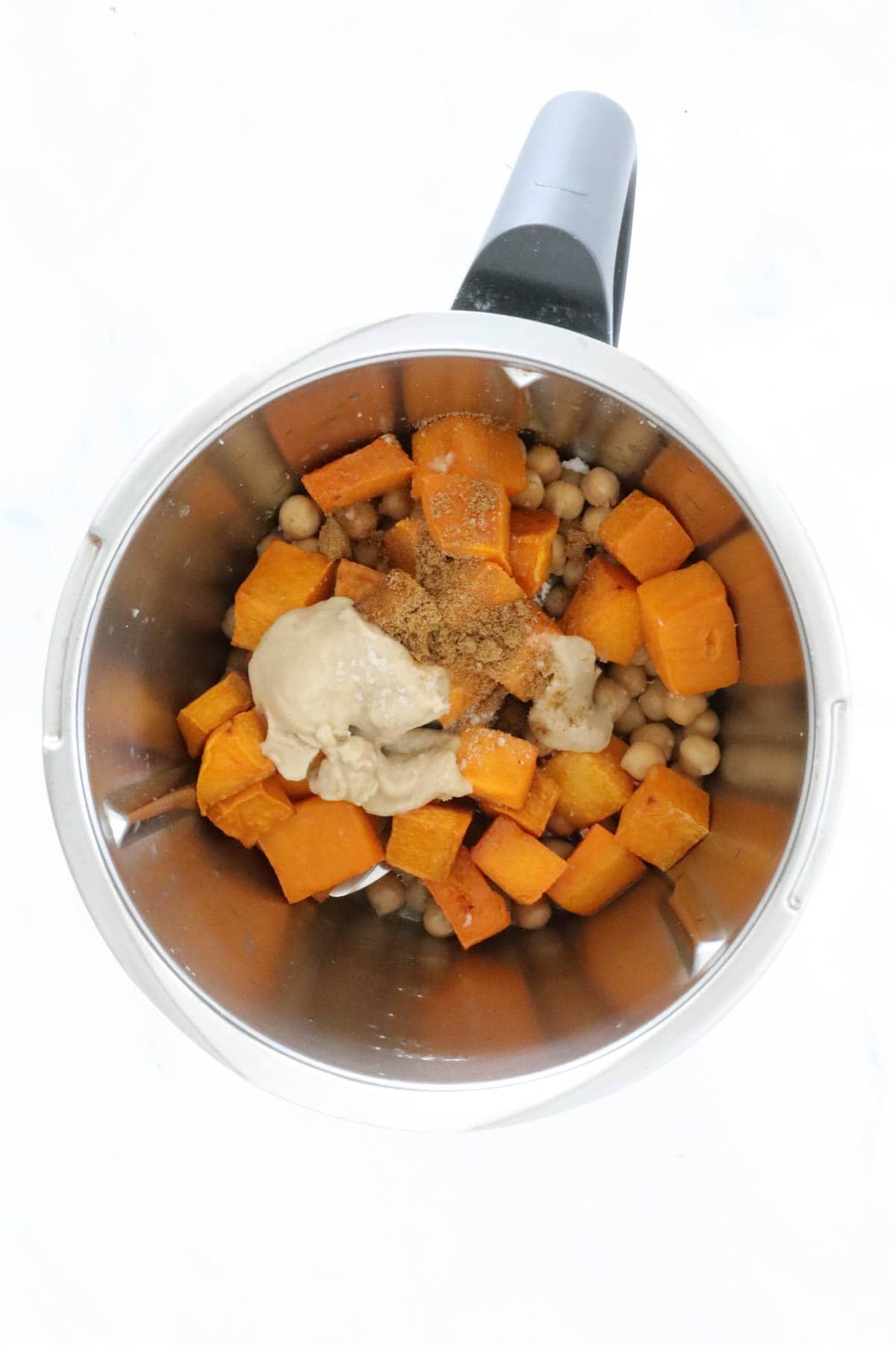 Roasted pumpkin, chickpeas and tahini in a Thermomix bowl.