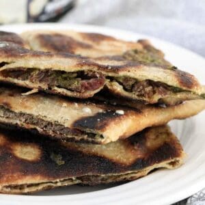 A stack of golden chargrilled lamb gozlemes.